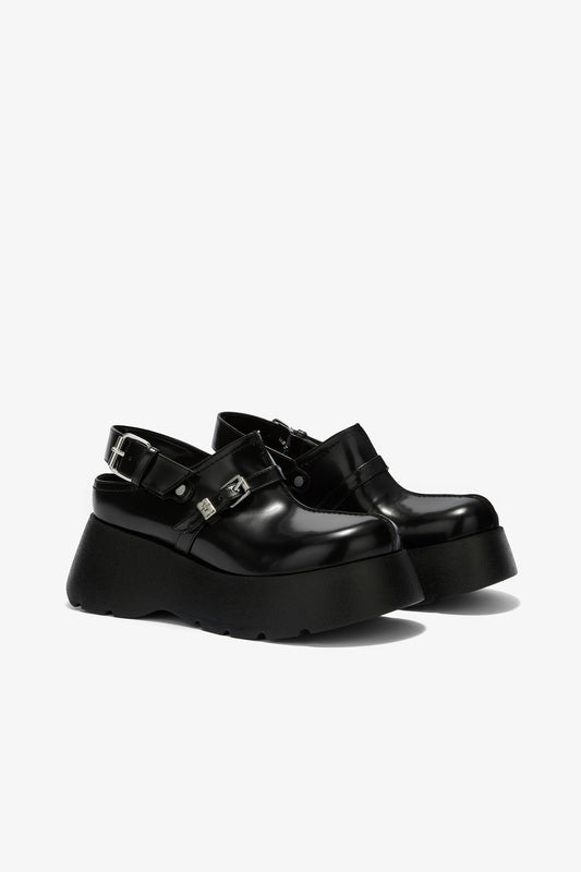 Platform Clogs in Black Oleatex