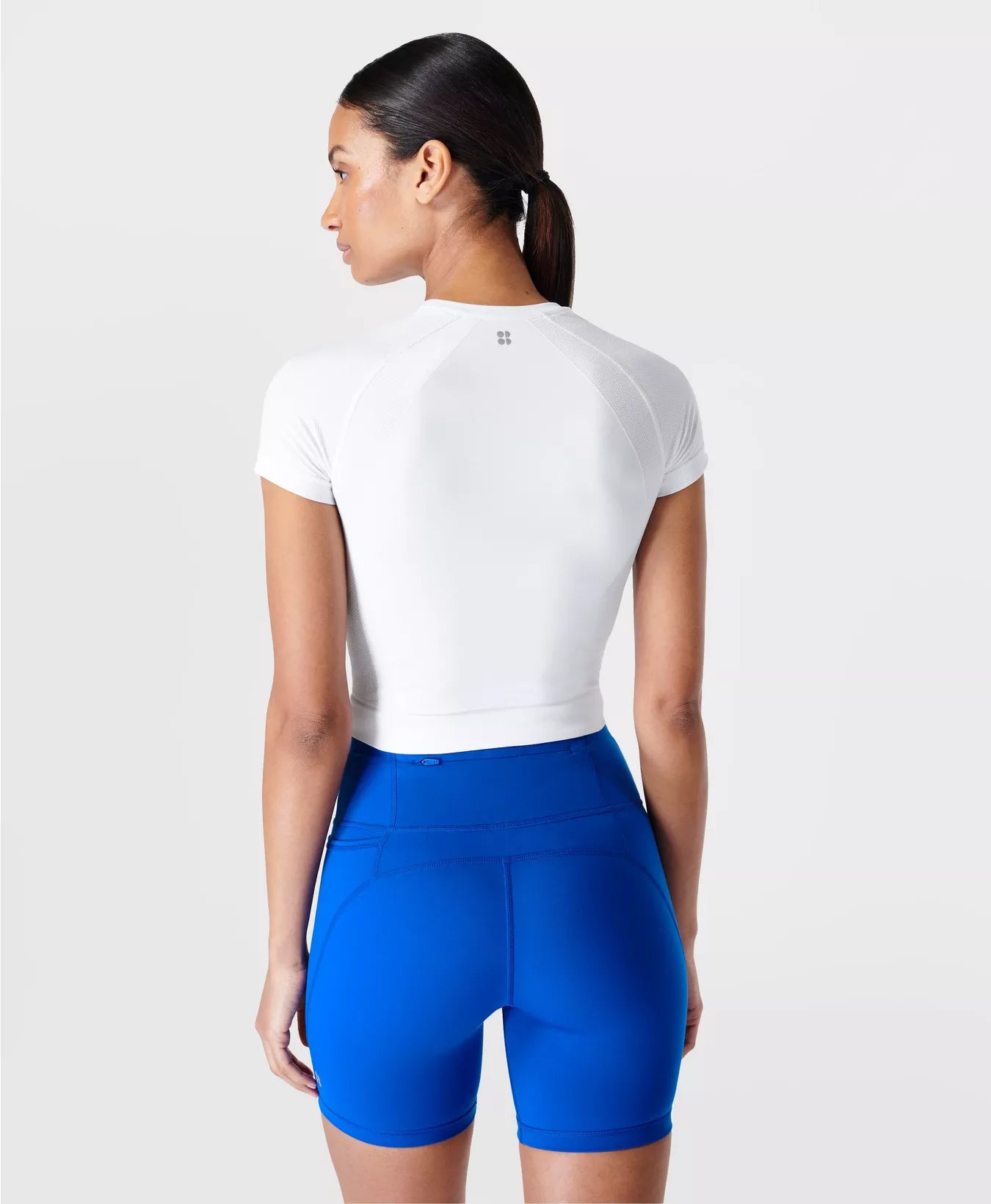 ATHLETE CROP SEAMLESS WORKOUT TEE WHITE - SWEATY BETTY